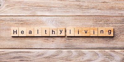 Healthy Living word written on wood block. Healthy Living text on wooden table for your desing, concept